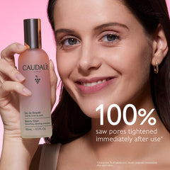 Caudalie 100 mL bottle held in hand to display travel-friendly scale