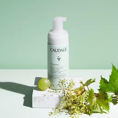 Caudalie 150 mL bottle beside a common item for size comparison convenience
