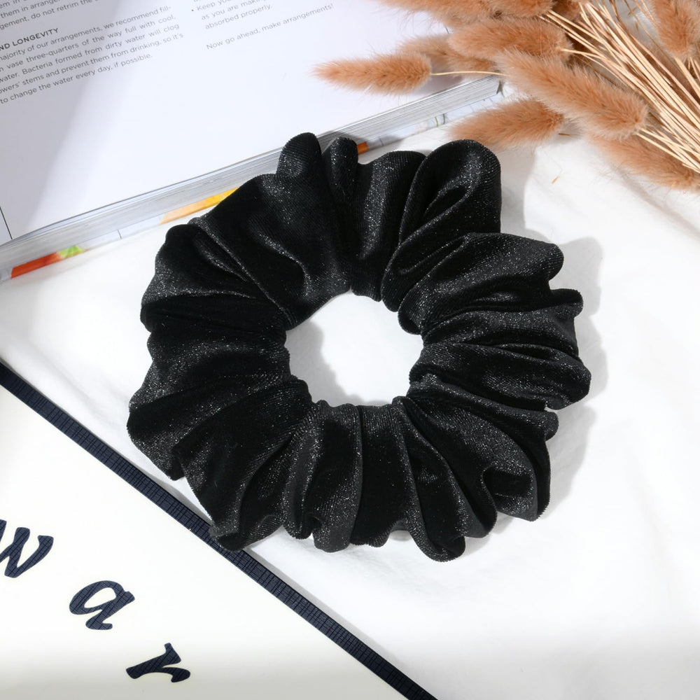 CEELGON scrunchie beside hand and ruler showing 6.5-inch diameter scale