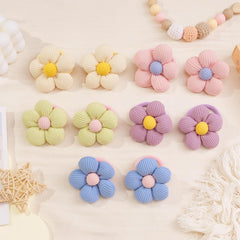 CÉLLOT used in a child’s braided style showing comfortable, non-damaging fit