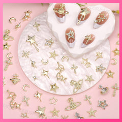 CESUSME assorted star, cross, moon and planet charms laid out for design planning