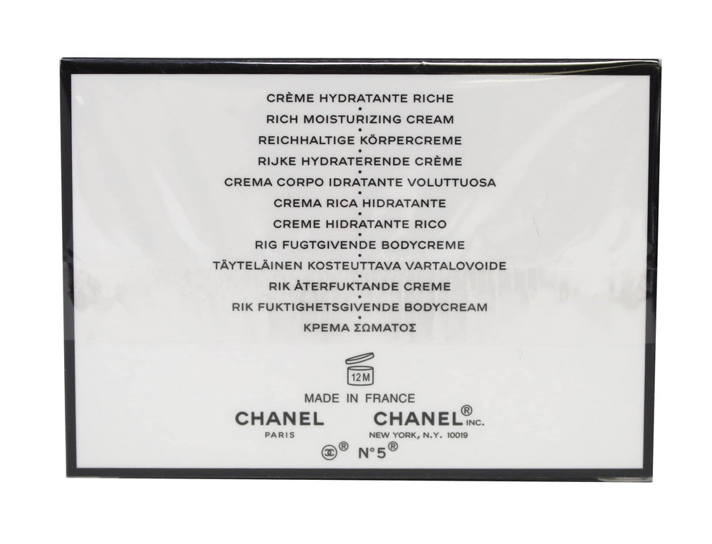 CHANEL N°5 cream close-up texture on fingertip highlighting rich moisturizing feel