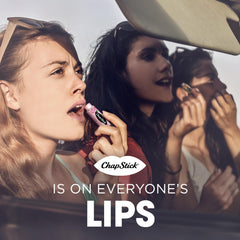 Open ChapStick tube gliding on lips demonstrating smooth application