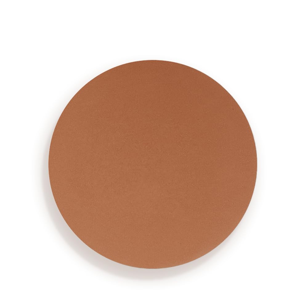 Charlotte Tilbury bronzer held in hand to show compact size and portability