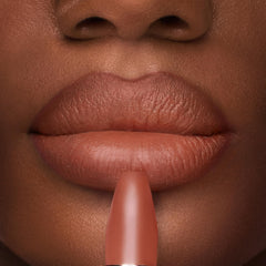 Charlotte Tilbury lip application close-up demonstrating smooth coverage