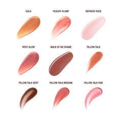Charlotte Tilbury gloss applied on lips in a daytime look providing subtle plumping benefit
