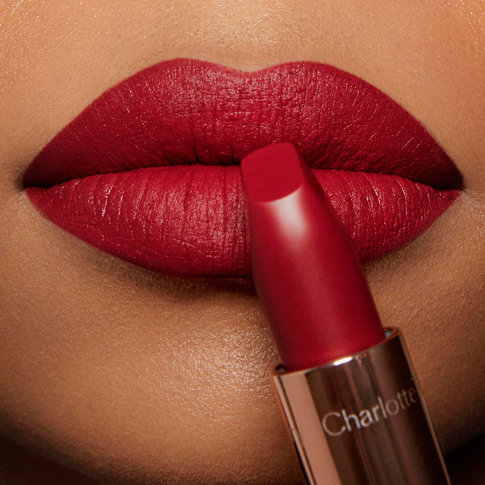 Charlotte Tilbury lipstick worn by model for an evening look providing classic glamorous finish