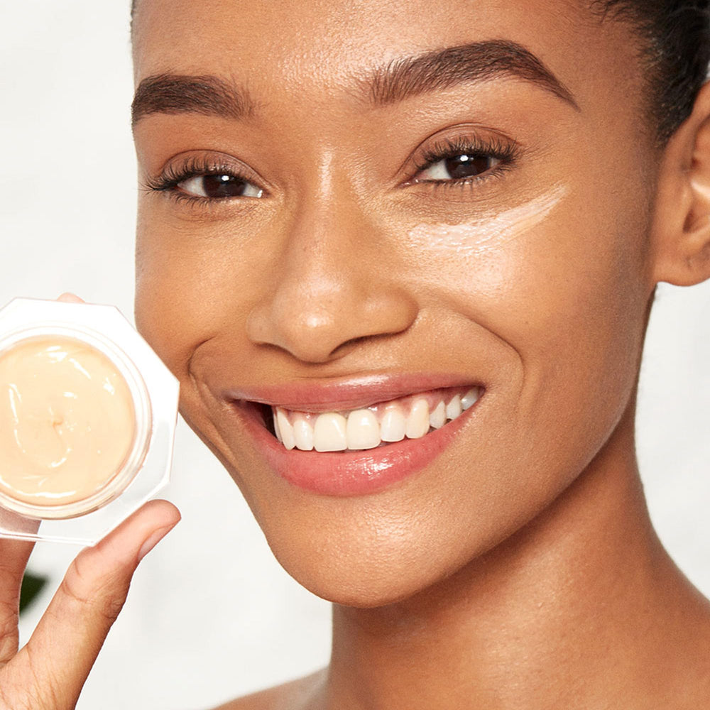 Charlotte Tilbury on a bathroom vanity in lifestyle scene signaling luxury routine and makeup preparation benefit