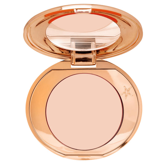 Charlotte Tilbury front packaging showing product and shade benefit of brightening