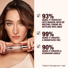 Charlotte Tilbury misting on model to set makeup, shows natural radiant finish