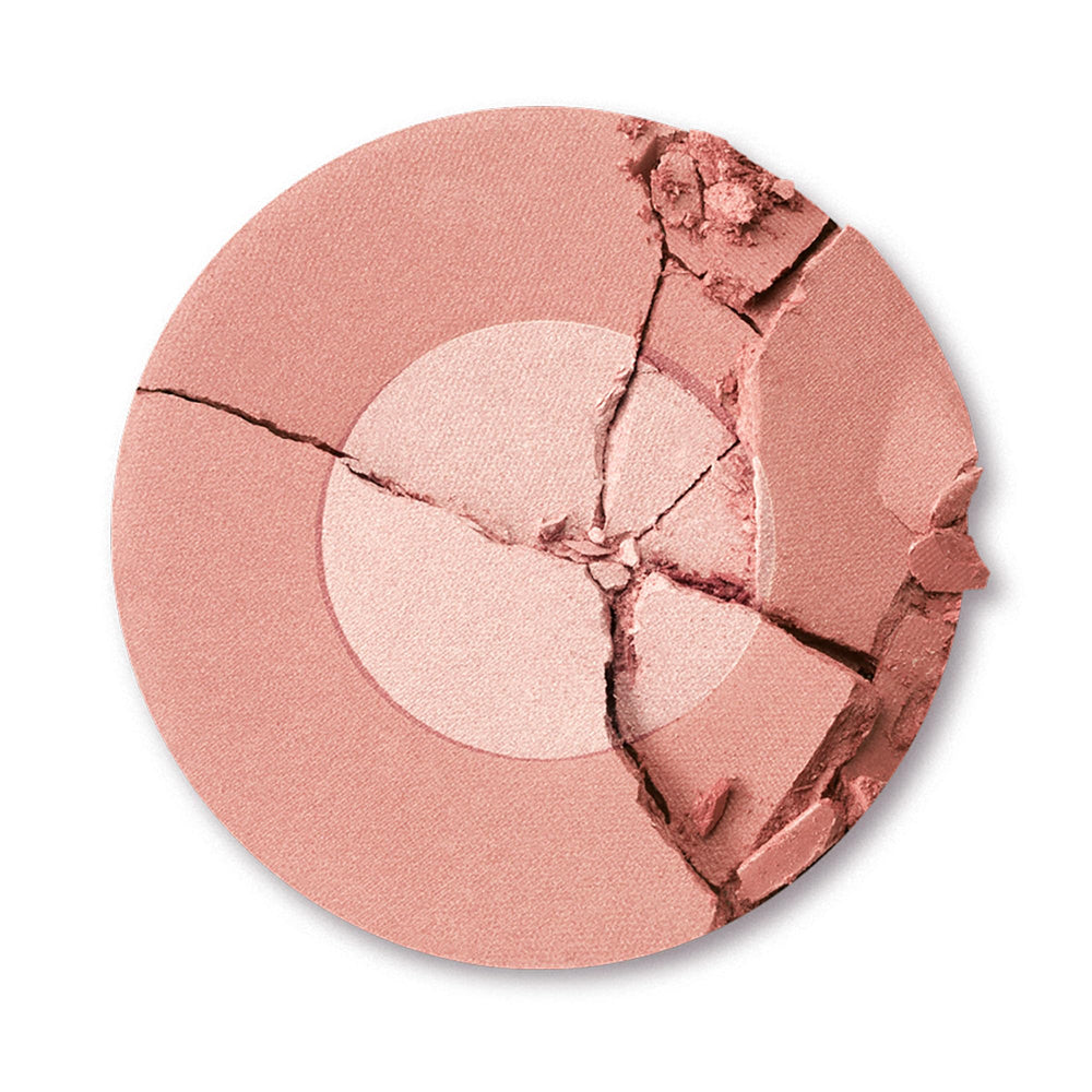 Charlotte Tilbury closeup of two‑tone powder texture highlighting shimmer and blendability