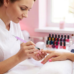 Chedin clean-up brush removing polish near cuticles for neater nail edges