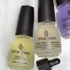 China Glaze .50 oz bottle next to a ruler to show compact travel-friendly size
