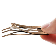 Chinco clip held in hand showing 2-inch scale and portable convenience