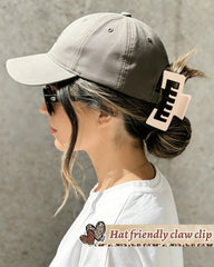 CHLINS clip holding a high ponytail under a cap showing secure non-slip hold