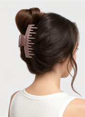 CHLINS clip next to a hand to show size and usable scale for all hair