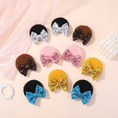 choicbaby hand holding bow for scale showing ideal 3-inch size