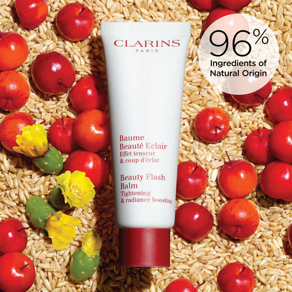 Clarins jar beside everyday items illustrating compact size and travel-friendly benefit