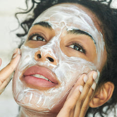 Clarins product held in hand to show scale and travel-friendly 6.7 oz size benefit