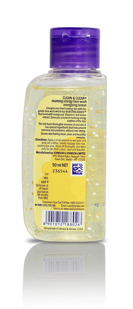 Clean & Clear bottle on bathroom shelf next to towels, shows compact 100ml travel-friendly size