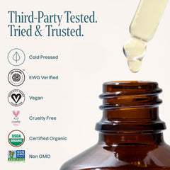 Cliganic argan oil on fingertips ready for face moisturization and hydration