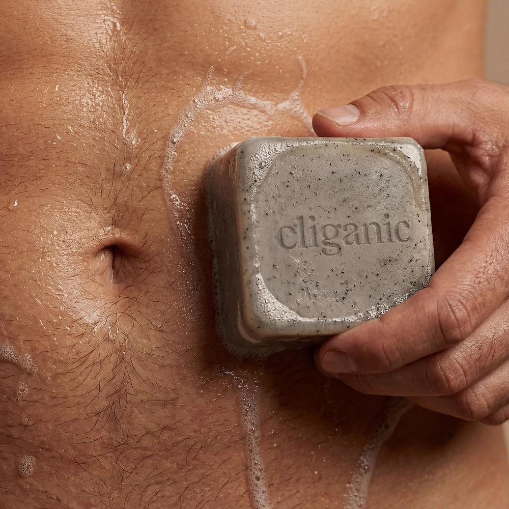 Cliganic Cypress Neroli bar held in palm showing handy size benefit: comfortable grip for shower use
