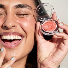 Clinique blush brushed onto cheek demonstrating easy application and buildable color benefit