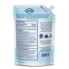 Clorox 34 oz bottle next to everyday items for scale, shows value-size refill capacity