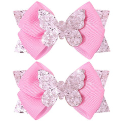 CN front view of two pink glitter butterfly bows showing shine and gifting appeal