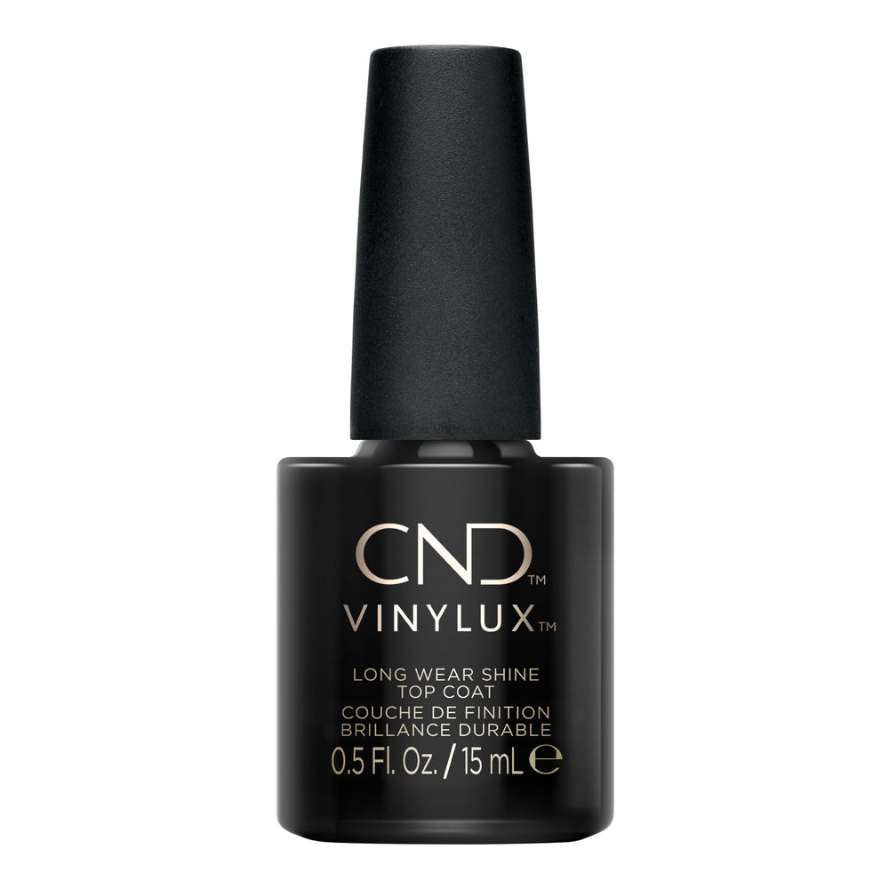 CND Vinylux brush applying top coat for smooth coverage and fast application