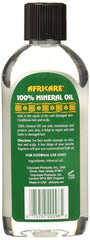 COCOCARE Africare oil drop on skin demonstrating hydration and shine benefits