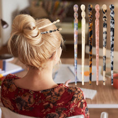 Model wearing Coldairsoap hair sticks in a classic low bun for stable, elegant updo