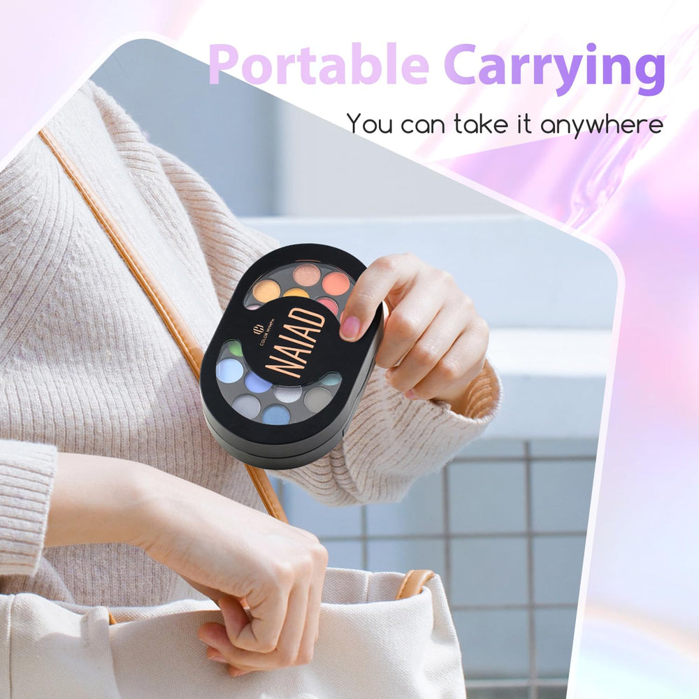 Color Nymph open palette top-down view displaying eyeshadows, glosses, and mirror