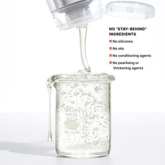 COLOR WOW bottle beside a hairbrush showing compact size and salon performance