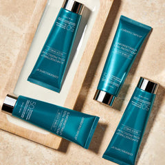 Colorescience body shield next to common items to show the 4 fl oz size