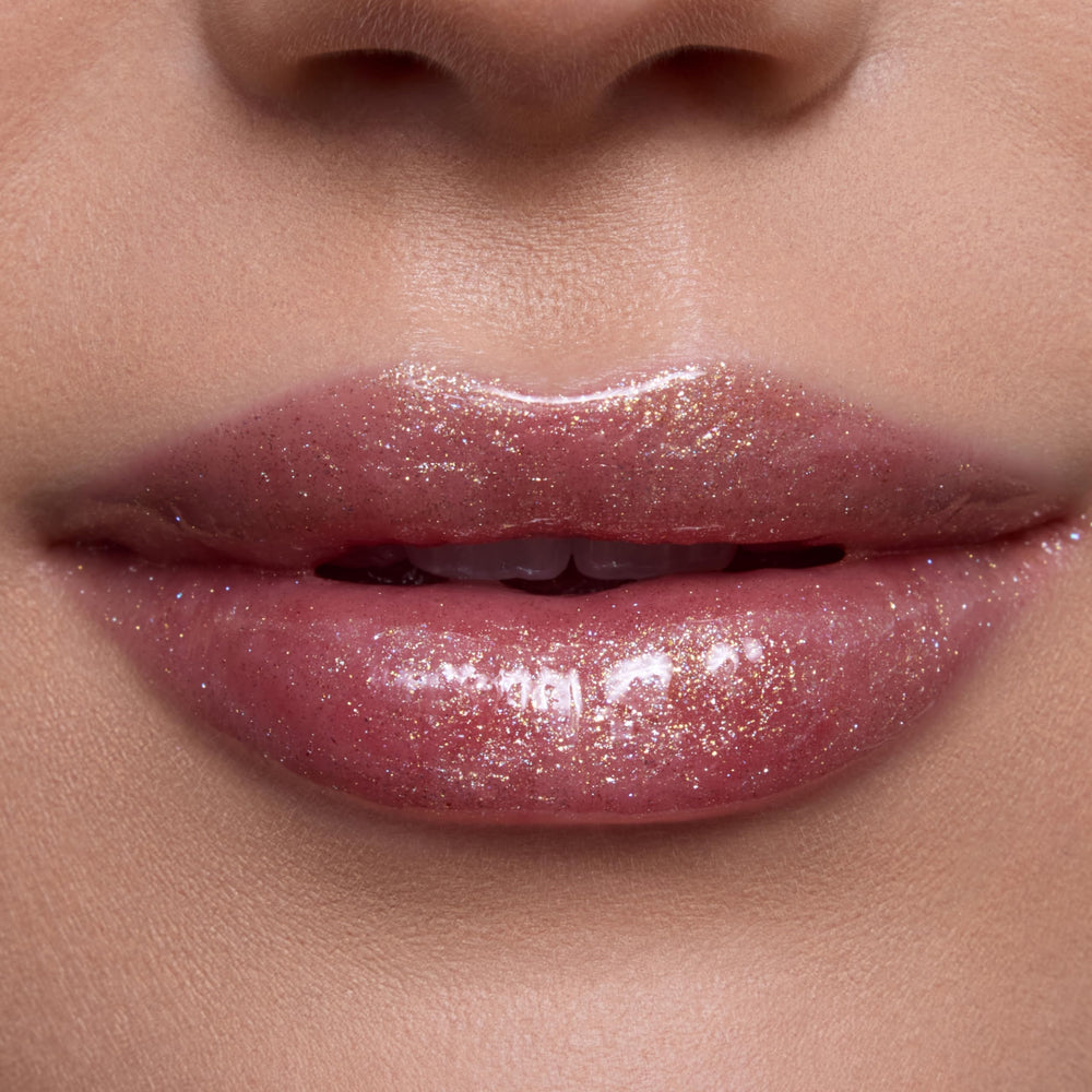ColourPop gloss texture swipe revealing sheer gold shimmer and hydrating finish