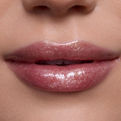 ColourPop gloss texture swipe revealing sheer gold shimmer and hydrating finish