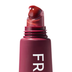 ColourPop Fresh Kiss Wild Berry in a handbag lifestyle for convenient touch-ups benefit