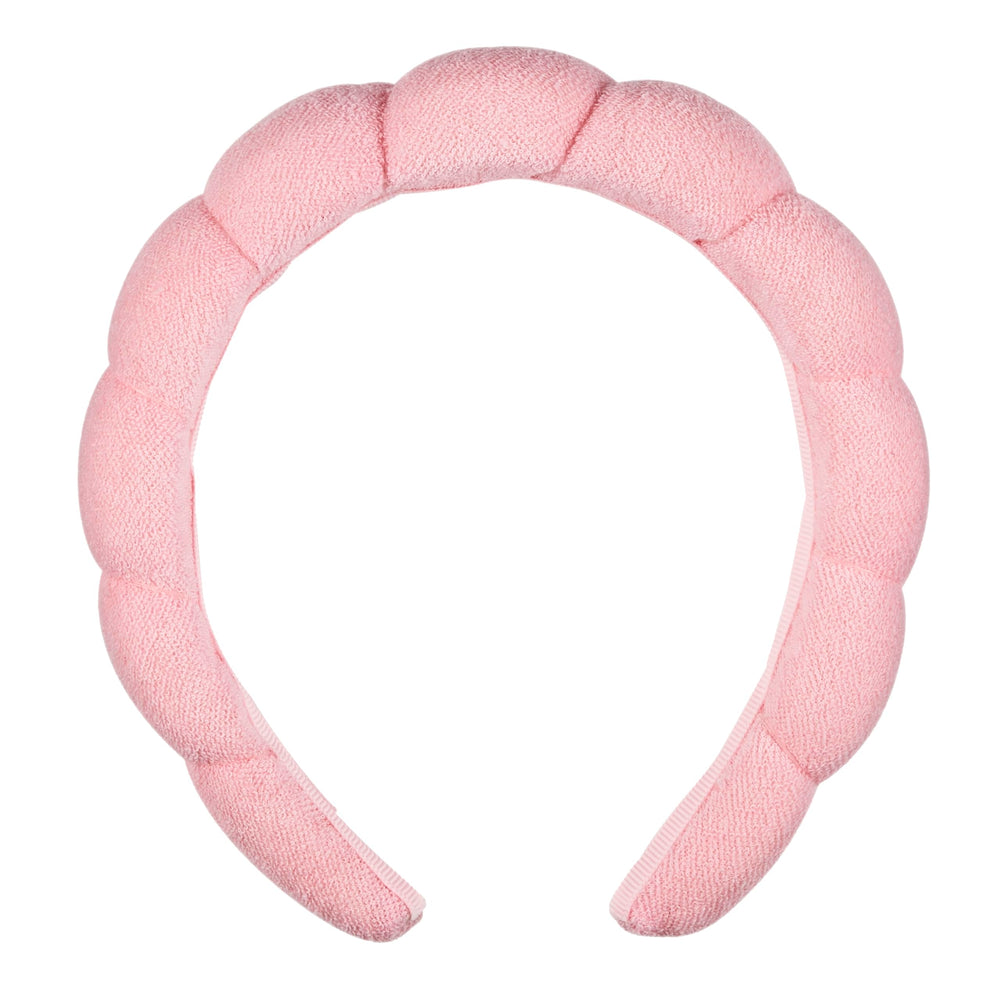 Conair front view of pink headband showing rounded shape and styling benefit