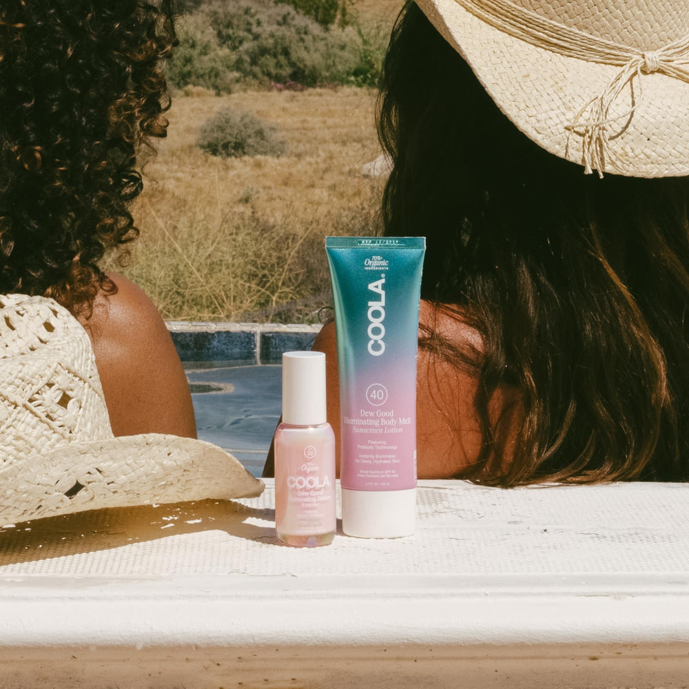 COOLA body melt on skin showing dewy illuminated finish and soft hydration
