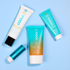 Coola travel flatlay with kit in a carry-on showing easy everyday portability