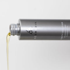 COSMEDIX bottle on bathroom shelf in lifestyle scene for routine-ready use