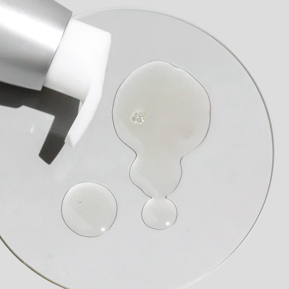 COSMEDIX bottle next to hand to show 100 ml size and travel-friendly benefit