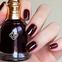 COSMOO swatch on nail tip illustrating true brown-red color payoff