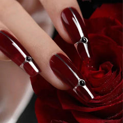 COSMOO swatch on nail wheel showing true cherry red payoff benefit