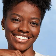 COVERGIRL brush applying blush to cheek for natural flushed benefit