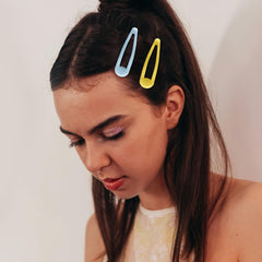 Cptots clips placed in bangs holding hair neatly for tidy appearance