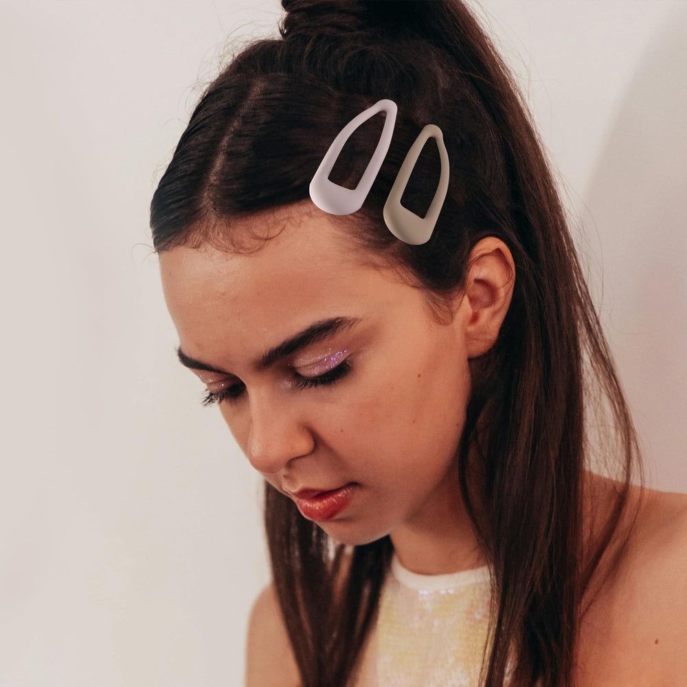 Cptots snap clip holding bangs in place for tidy, no-slip styling