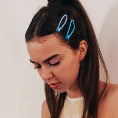 Cptots clip in use on side hair, keeps hair tidy during activity
