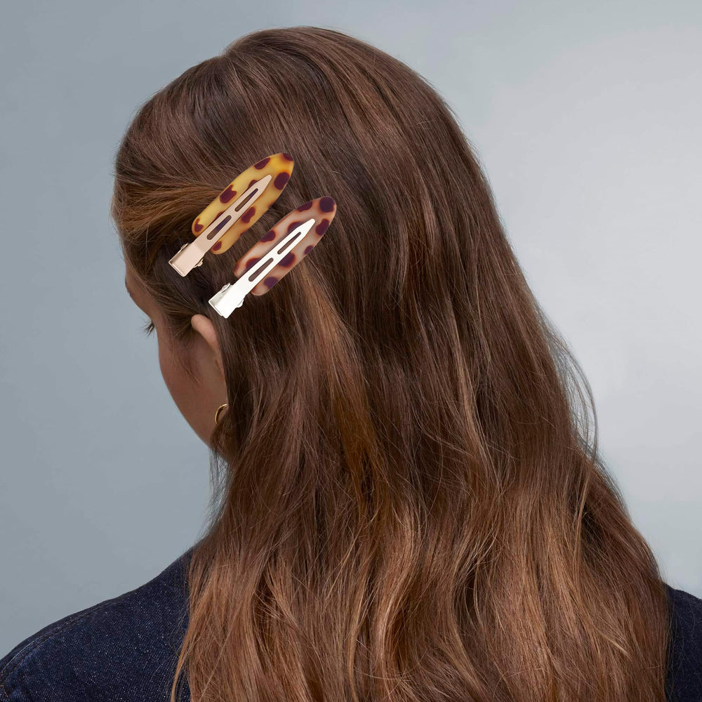 Cptots assorted five-color clips laid out for styling options